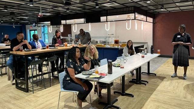 Focus Group members sitting at tables and desks