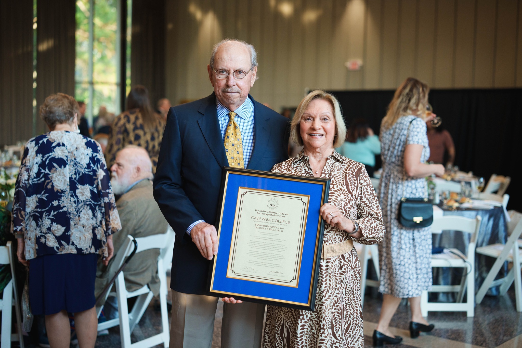 Bob & Susan Arnold pose with their Shuford Award