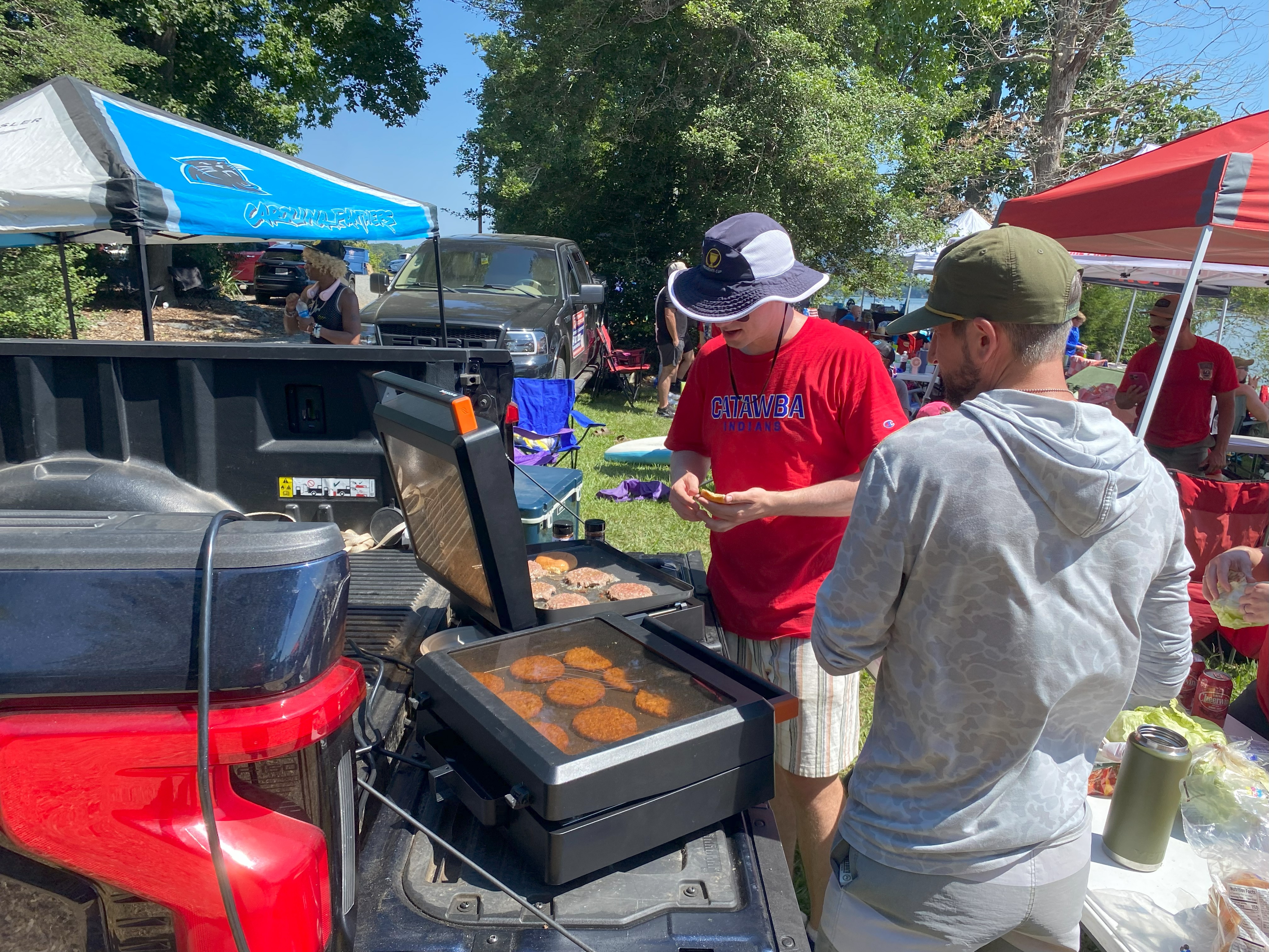 Kiel and Noah cook up some burgers on the Ford Lightning powered grill