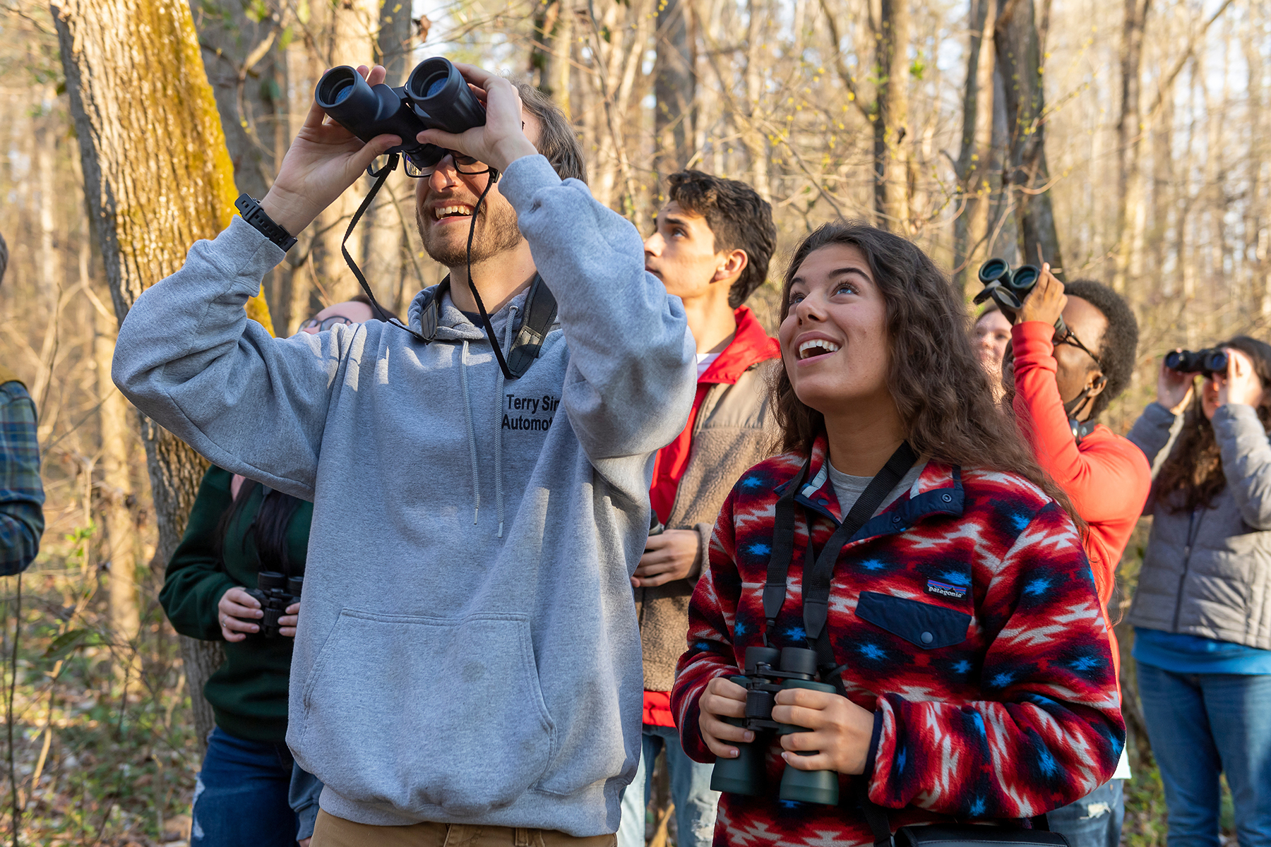 Environment and Sustainability Student with binoculars in Preserve
