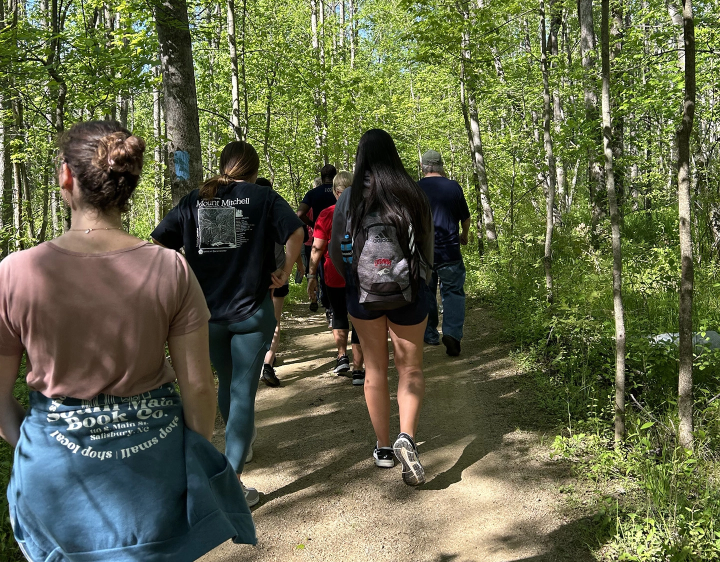 People taking nature walk through preserve