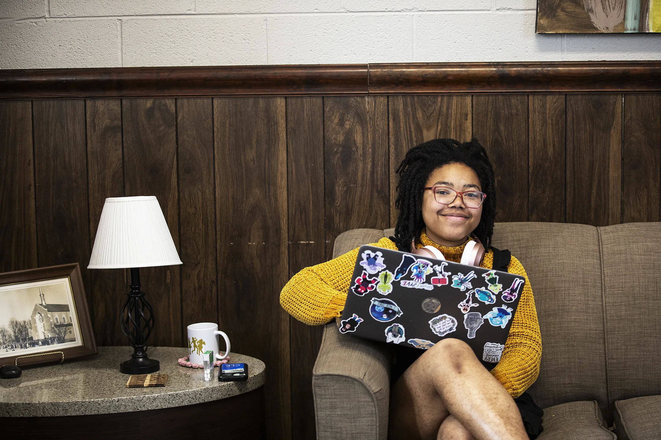 Student on laptop smiling