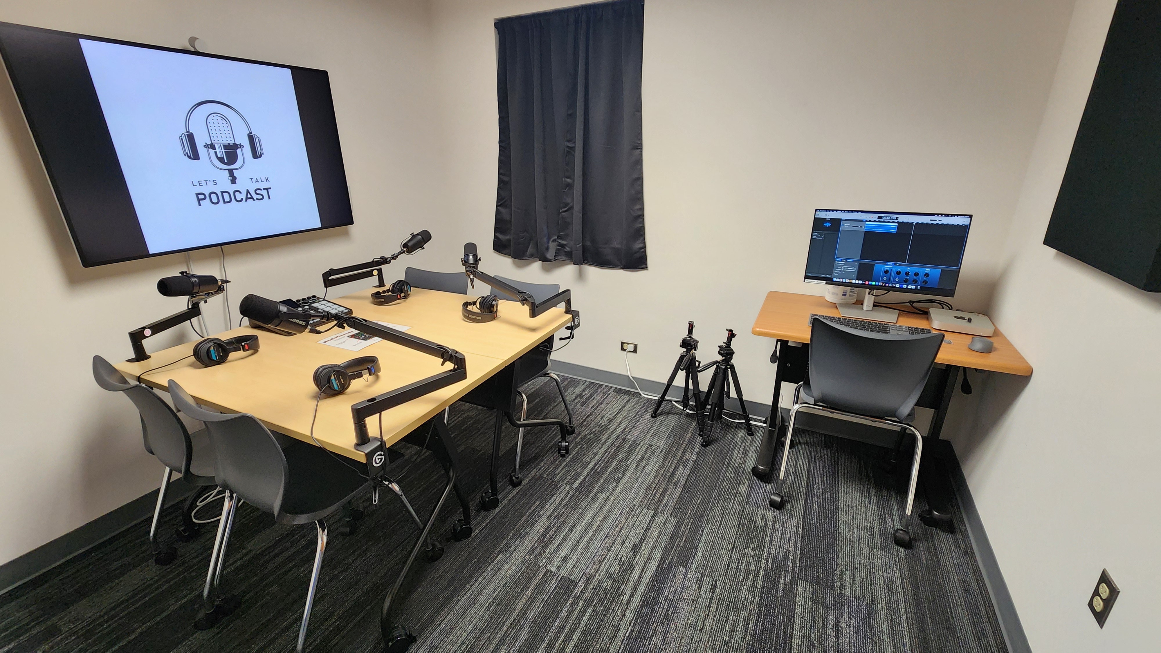 Podcasting Room with display, microphones, and editing software.