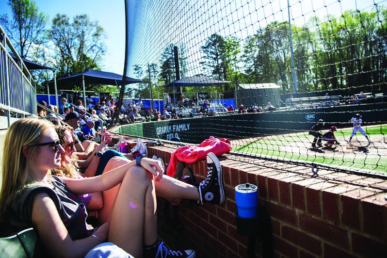 Fans in the stands at Newman Park with view of the field 